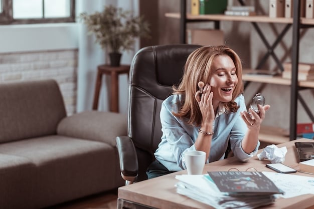 A person on the phone, smiling and looking relieved while sitting at a desk. The image should convey a sense of successful negotiation and relief from financial stress.