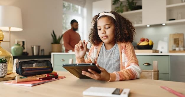 A person using a tablet to browse a digital coupon website while sitting at a kitchen table with a shopping list in front of them.