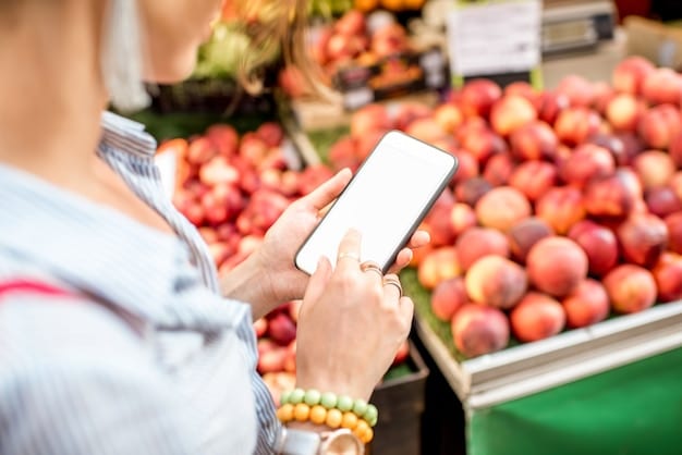 A person using a smartphone in a produce section, comparing prices and adding organic items to a digital shopping list, illustrating the use of technology to plan and save on organic groceries.