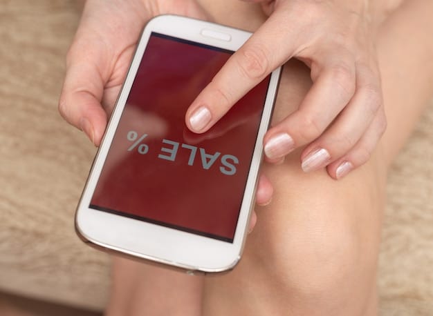 A close-up of a smartphone displaying a grocery shopping app with coupons and discount codes highlighted on the screen.
