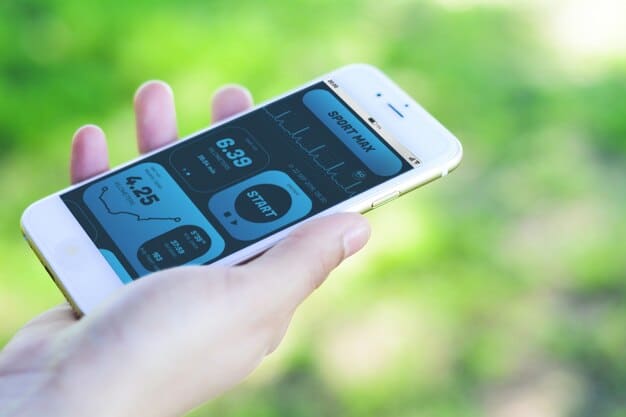 A close-up shot of a smartphone screen displaying an energy monitoring app, showing detailed electricity and gas usage graphs and historical data, with a person's hand holding the phone.