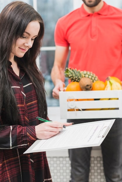 A shopper meticulously reviewing a grocery list and crossing off items, indicating careful planning and strategic purchasing decisions.