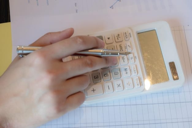 A close-up of a hand holding a calculator with numbers, suggesting financial planning and careful calculation for debt reduction.