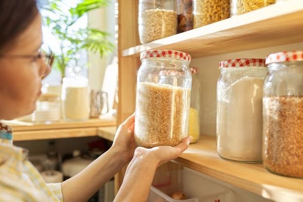 A person carefully arranging various dry goods in clear, airtight containers in a neatly organized pantry, emphasizing smart bulk storage.