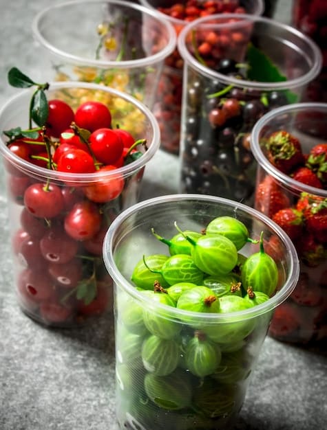 A detailed close-up of different types of pre-cut vegetables in plastic containers on a supermarket shelf, highlighting their ready-to-use nature.