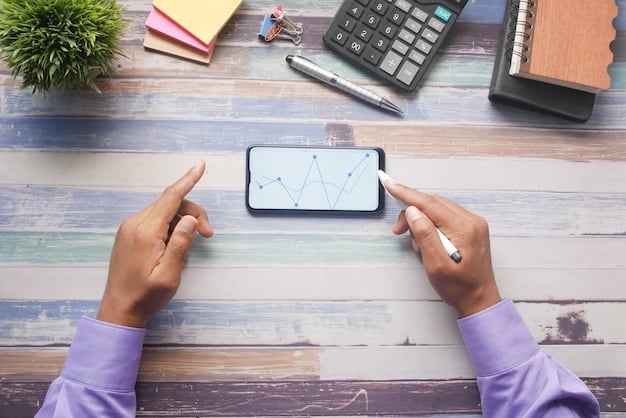 A person's hand holding a smartphone showing a budget app with various expense categories, indicating smart financial management.