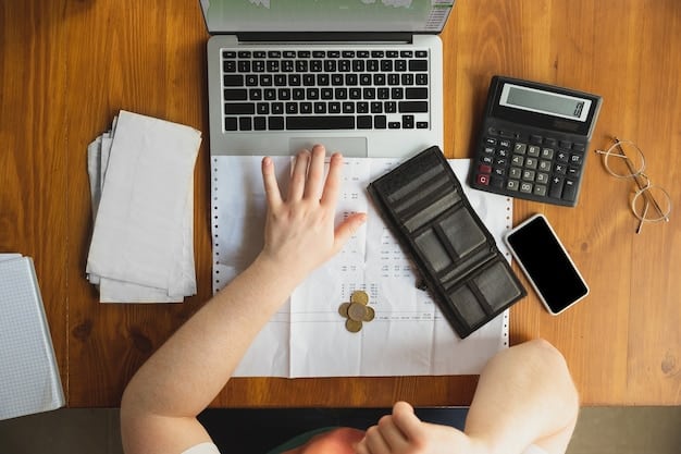 A person using a calculator with financial documents scattered on a table, symbolizing budget adjustments and financial review.