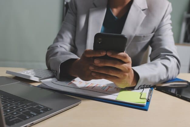 A person on the phone, looking determined, with medical documents spread on a table, representing active negotiation and advocacy.