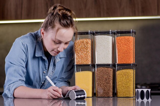 A shopper in a grocery store, carefully comparing two different brands of cereal based on their unit prices displayed on the shelf labels. They are using a smartphone calculator to double-check the math and ensure they are getting the best deal. The focus is on the shopper's informed decision-making process and how unit pricing aids in making cost-effective choices while shopping. Grocery Shopping Hacks: How to Use Unit Pricing to Find the Best Deals is clearly at play in this scenario.