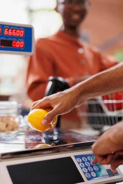 A person paying for groceries with cash at a checkout counter. The focus is on the cash and the act of physically handing over the money.