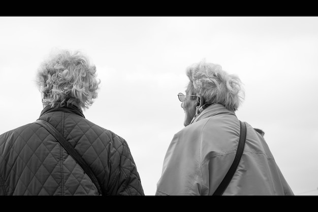 A split image depicting two contrasting retirement scenarios: on one side, a couple enjoying a vibrant and secure retirement, and on the other, a person facing financial struggles and uncertainty. The image is meant to highlight the importance of Social Security in ensuring a comfortable retirement.